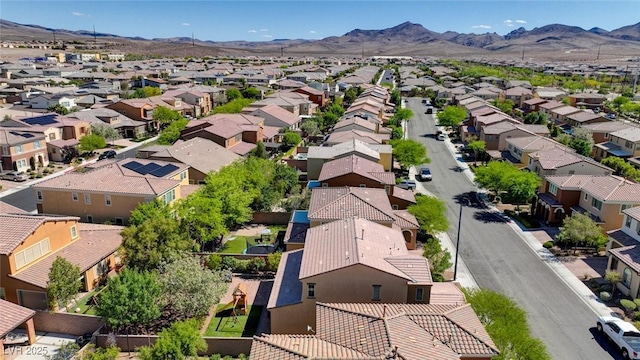 aerial view of residential area with a mountainous background