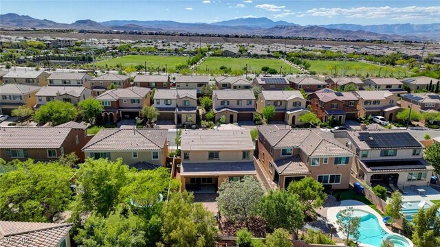 aerial view of residential area with a mountainous background