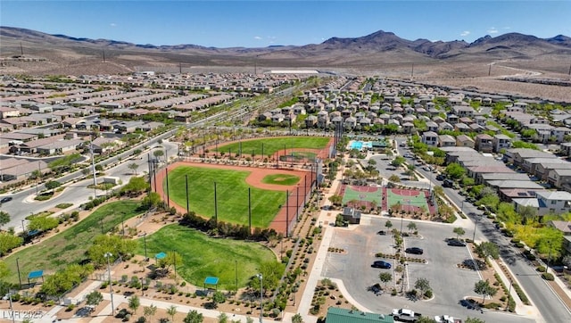 aerial view of residential area featuring a mountainous background