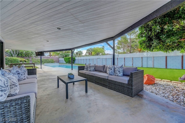 7140 Palmyra Ave, Las Vegas, NV 89117 - fenced backyard with an outdoor hangout area and a patio area
