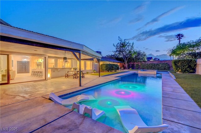 7140 Palmyra Ave, Las Vegas, NV 89117 - view of swimming pool featuring an in-ground hot tub and a patio