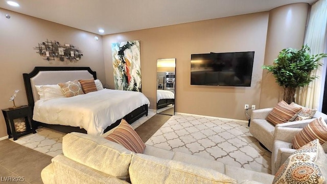 bedroom featuring baseboards and recessed lighting