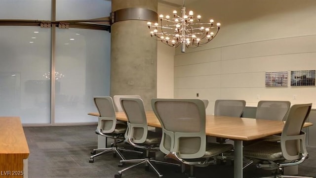 carpeted dining room featuring a chandelier