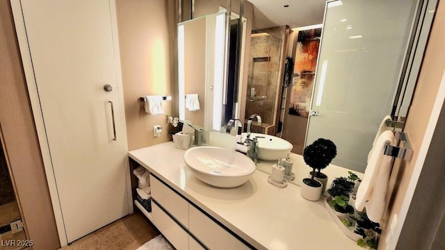 bathroom with a stall shower and vanity