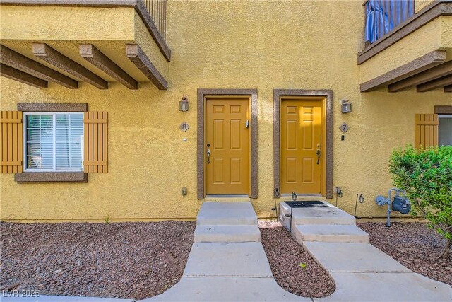 5915 Nuevo Leon St Unit 8, North Las Vegas, NV 89031 - entrance to property featuring stucco siding