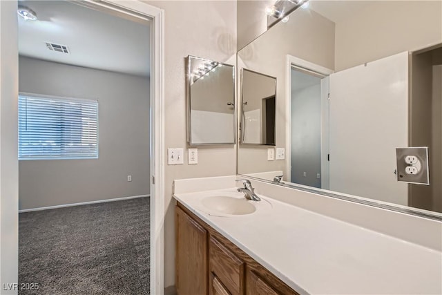 5915 Nuevo Leon St Unit 8, North Las Vegas, NV 89031 - bathroom featuring vanity and baseboards