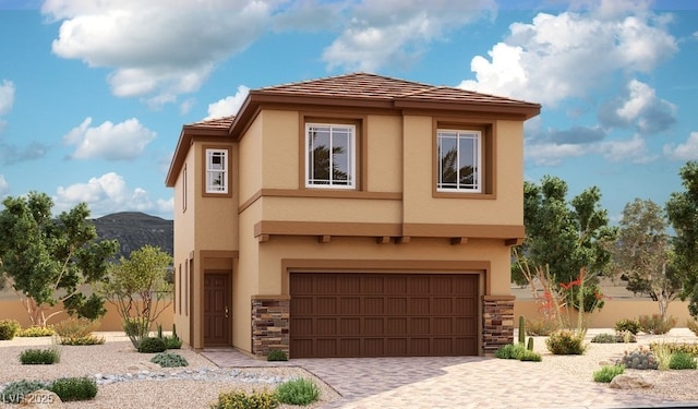 view of front facade featuring stucco siding, stone siding, and a garage