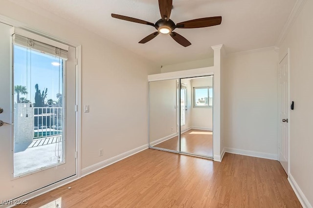 4302 Newhaven Dr, Las Vegas, NV 89147 - unfurnished bedroom with light wood finished floors, baseboards, ornamental molding, a ceiling fan, and a closet