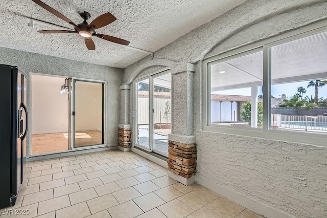 4302 Newhaven Dr, Las Vegas, NV 89147 - unfurnished sunroom with a textured ceiling