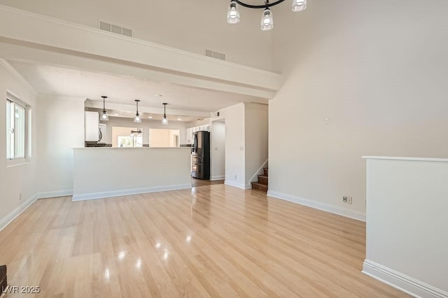 4302 Newhaven Dr, Las Vegas, NV 89147 - unfurnished living room with light wood-type flooring, stairway, and baseboards