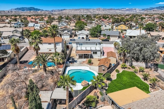 4302 Newhaven Dr, Las Vegas, NV 89147 - aerial view of property's location with nearby suburban area, a pool area, and a mountain backdrop