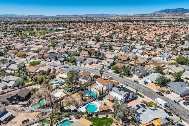 4302 Newhaven Dr, Las Vegas, NV 89147 - aerial view of property and surrounding area featuring a mountain backdrop, nearby suburban area, and a pool area