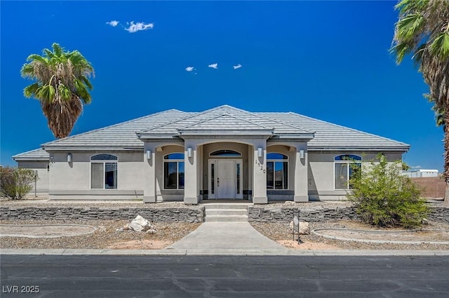 1420 Logandale Dr, Logandale, NV 89021 - view of front of home with stucco siding and a tile roof