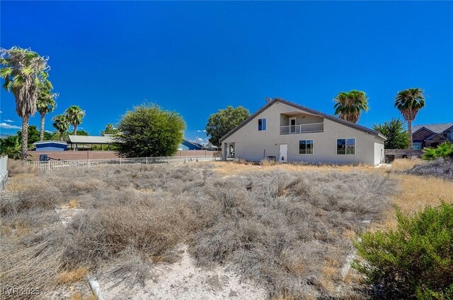 1420 Logandale Dr, Logandale, NV 89021 - view of side of home featuring stucco siding and fence