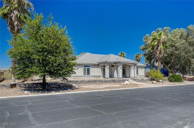 1420 Logandale Dr, Logandale, NV 89021 - view of front of home with stucco siding and a tile roof