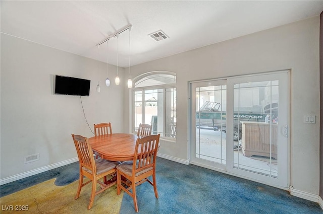 1420 Logandale Dr, Logandale, NV 89021 - dining room with track lighting and baseboards