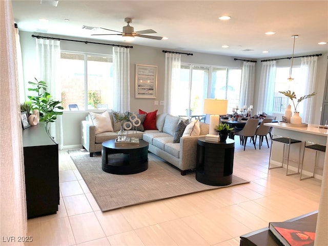 6511 Dove Point Pl, Las Vegas, NV 89130 - living room with healthy amount of natural light, a ceiling fan, recessed lighting, and light tile patterned floors