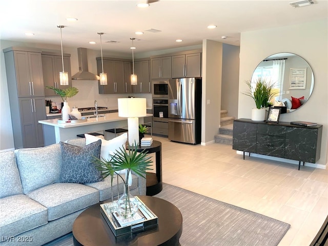 6511 Dove Point Pl, Las Vegas, NV 89130 - living area with stairway, baseboards, light tile patterned floors, and recessed lighting
