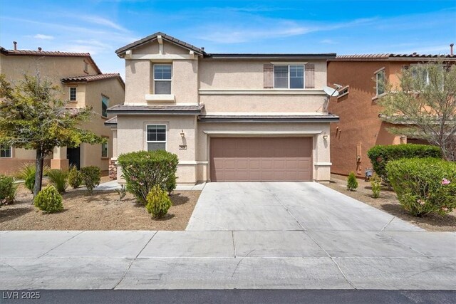 3638 Via Messina, Henderson, NV 89052 - view of front facade featuring stucco siding, an attached garage, and driveway