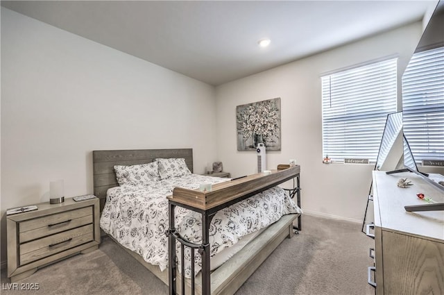 carpeted bedroom featuring baseboards