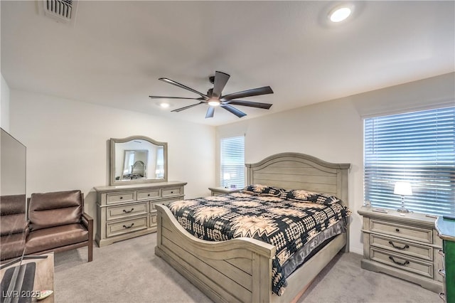 bedroom featuring light colored carpet, baseboards, a ceiling fan, and recessed lighting