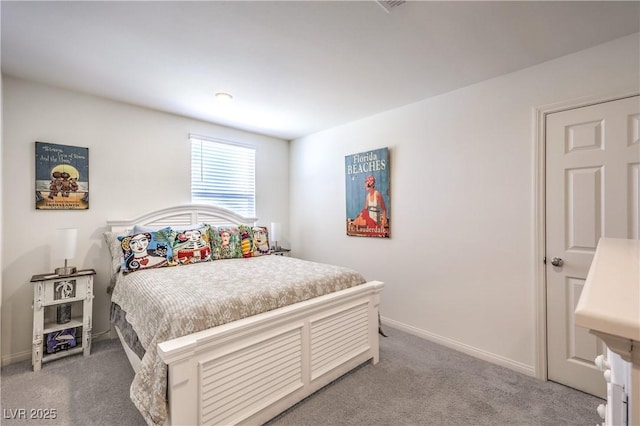 bedroom with carpet floors and baseboards