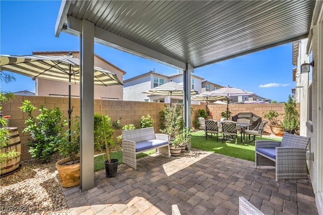 view of patio / terrace featuring a fenced backyard and outdoor dining area