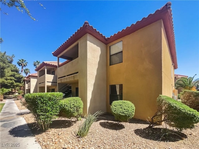 3135 S Mojave Rd Unit 152, Las Vegas, NV 89121 - view of home's exterior featuring stucco siding and a tile roof