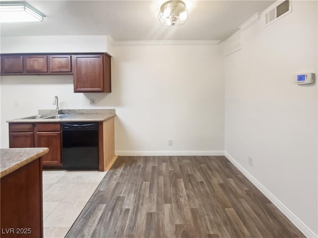3135 S Mojave Rd Unit 152, Las Vegas, NV 89121 - kitchen featuring dishwasher, a sink, light wood-style floors, light countertops, and baseboards