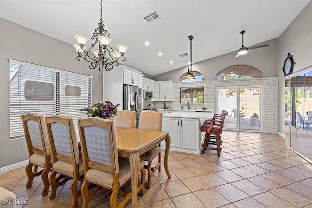 5421 Tourmaline St, Las Vegas, NV 89130 - dining space featuring a chandelier, light tile patterned floors, a ceiling fan, high vaulted ceiling, and baseboards