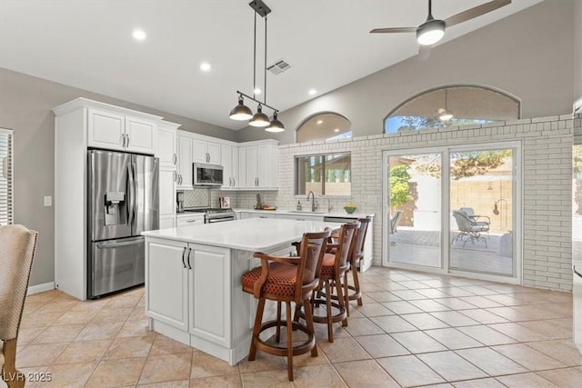 5421 Tourmaline St, Las Vegas, NV 89130 - kitchen with appliances with stainless steel finishes, light countertops, a sink, white cabinetry, and recessed lighting
