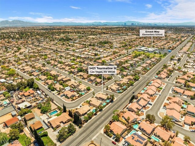 5421 Tourmaline St, Las Vegas, NV 89130 - aerial perspective of suburban area featuring a mountainous background