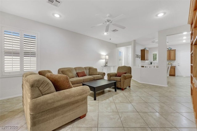 living room featuring ceiling fan, baseboards, recessed lighting, and light tile patterned floors