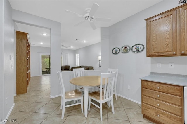 dining area featuring a ceiling fan, recessed lighting, light tile patterned floors, and baseboards