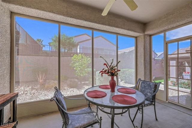 sunroom featuring concrete floors