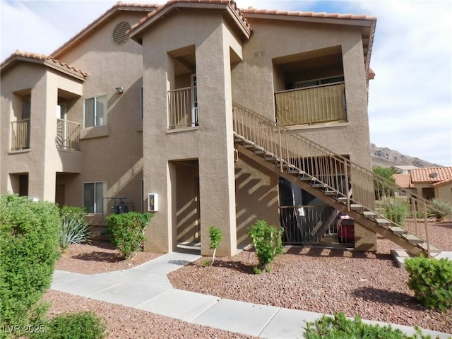 view of property featuring stairway