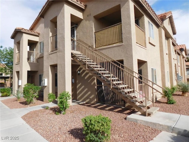 view of building exterior with stairway