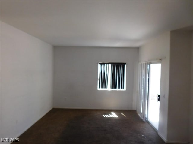 unfurnished room with carpet flooring