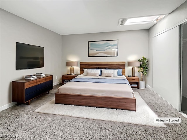 carpeted bedroom with baseboards