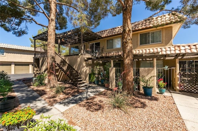 718 Nectarine Ct, Henderson, NV 89014 - townhome / multi-family property with a tile roof, stairs, and stucco siding