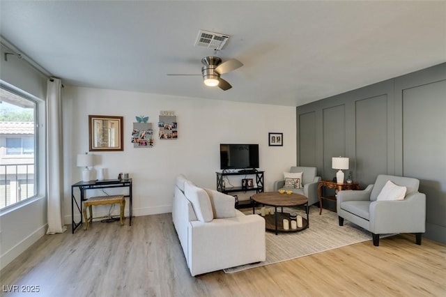 718 Nectarine Ct, Henderson, NV 89014 - living room featuring light wood finished floors, a ceiling fan, and baseboards