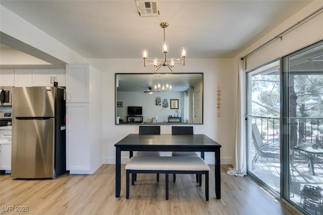 718 Nectarine Ct, Henderson, NV 89014 - dining area featuring a chandelier, light wood-type flooring, and baseboards