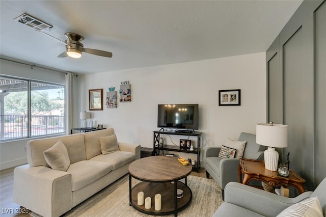 718 Nectarine Ct, Henderson, NV 89014 - living area featuring light wood-style floors, ceiling fan, and baseboards