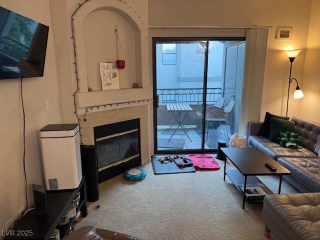 8250 N Grand Canyon Dr Unit 2154, Las Vegas, NV 89166 - carpeted living area with a glass covered fireplace