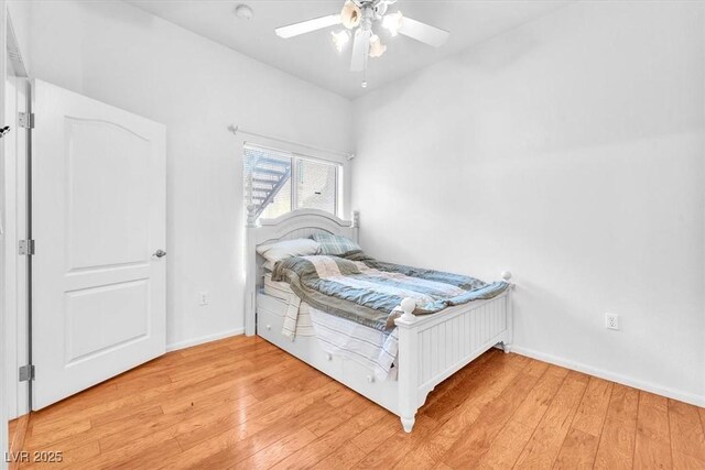 8985 S Durango Dr Unit 1110, Las Vegas, NV 89113 - bedroom featuring light wood-style floors, baseboards, and ceiling fan