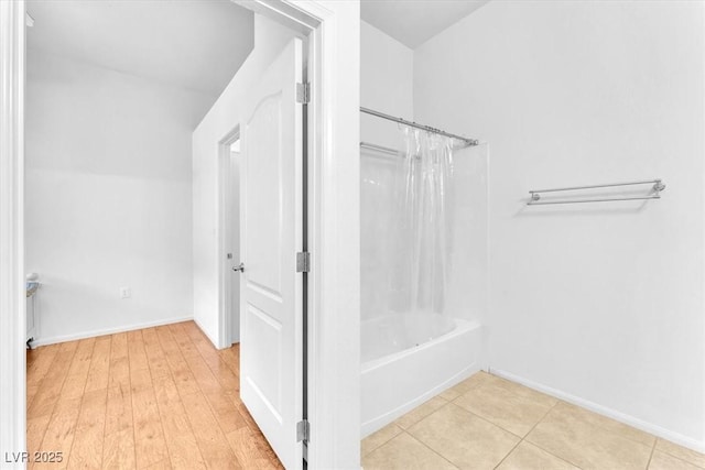 8985 S Durango Dr Unit 1110, Las Vegas, NV 89113 - bathroom with shower / bath combo with shower curtain and baseboards