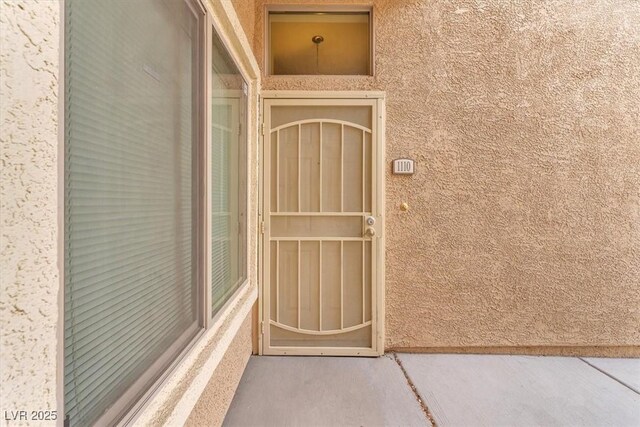 8985 S Durango Dr Unit 1110, Las Vegas, NV 89113 - doorway to property featuring stucco siding