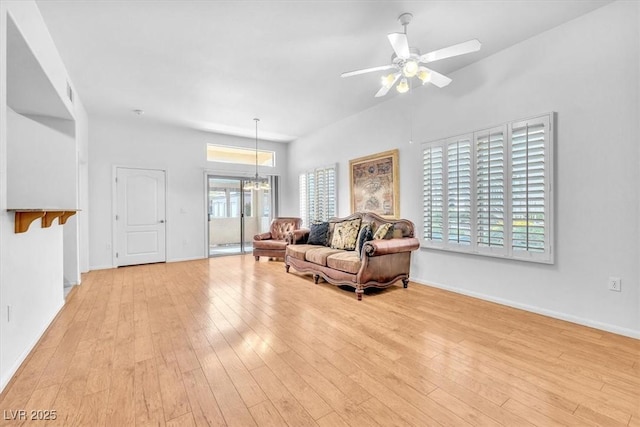 8985 S Durango Dr Unit 1110, Las Vegas, NV 89113 - living area featuring light wood-style floors, a ceiling fan, and baseboards