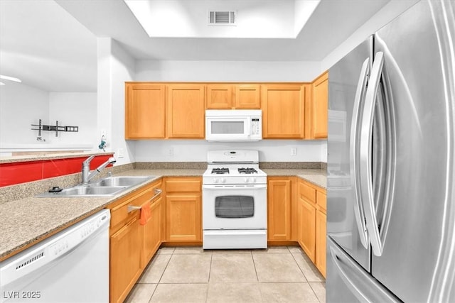 8985 S Durango Dr Unit 1110, Las Vegas, NV 89113 - kitchen featuring white appliances, a sink, light tile patterned floors, light countertops, and a tray ceiling