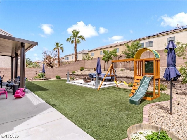 view of playground with a patio area and a residential view